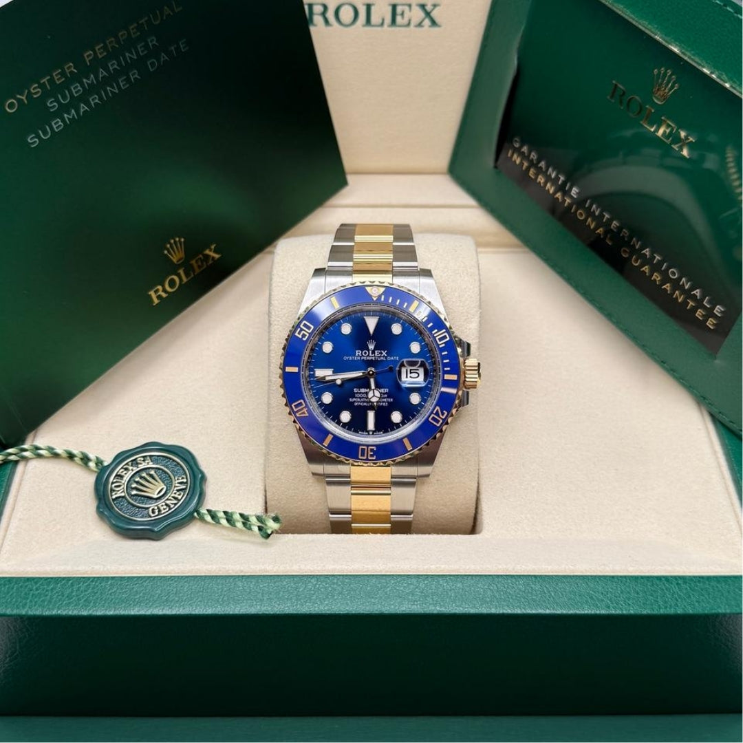 Blue and gold watch in presentation box